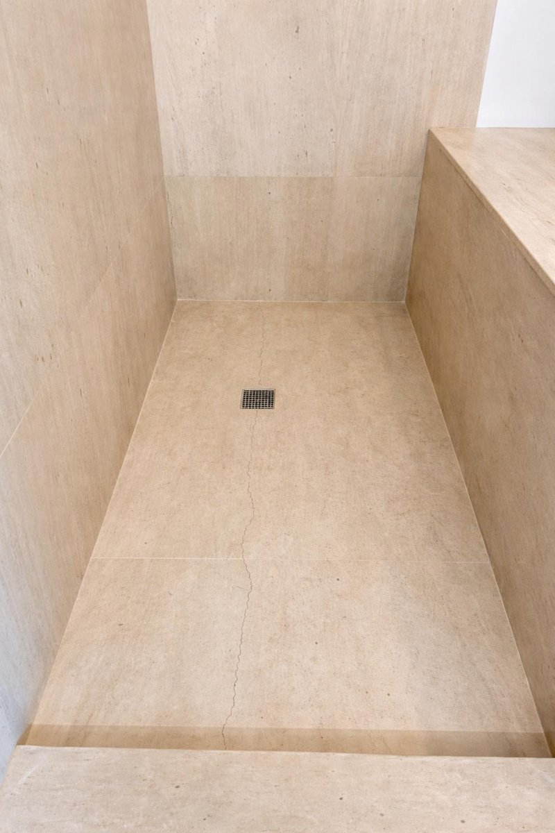 Before - Travertine shower cracked grout